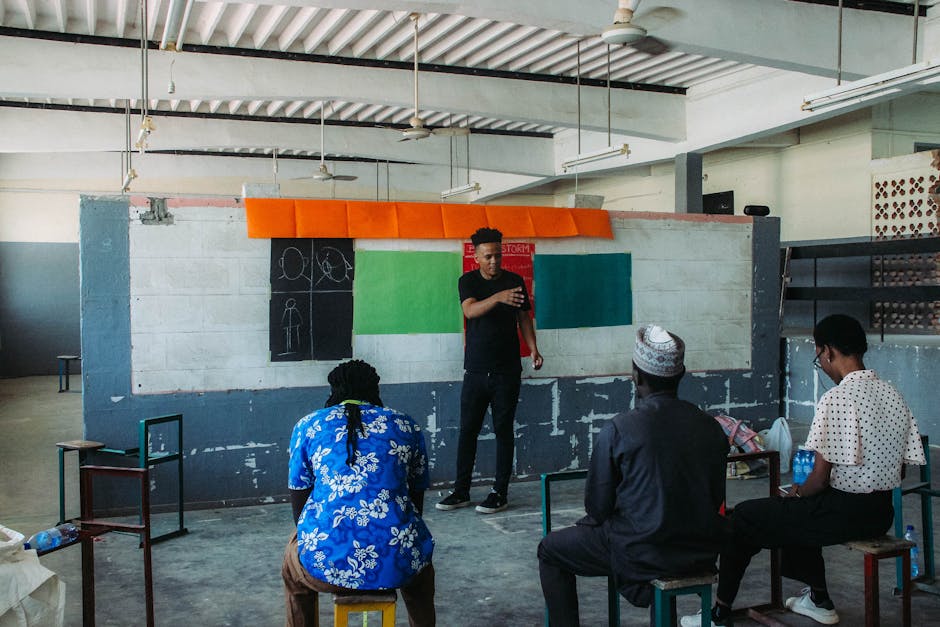 A creative workshop session with diverse individuals in an urban art studio setting.
